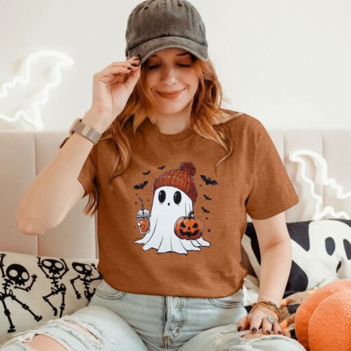 Halloween t-shirt featuring a ghost, pumpkin, and bats design.