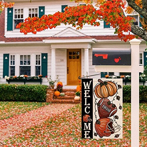 Autumn welcome flag with pumpkins in front of house