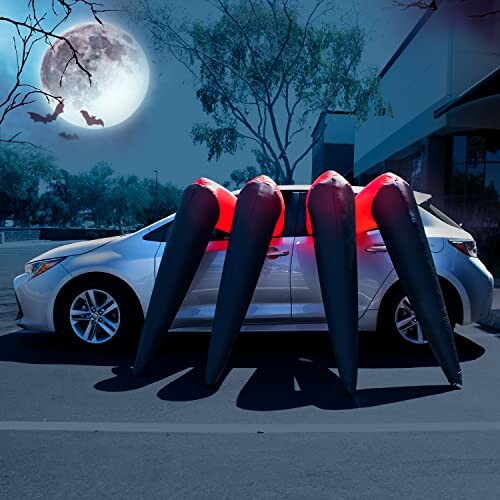 Car with inflatable spider legs decoration for Halloween