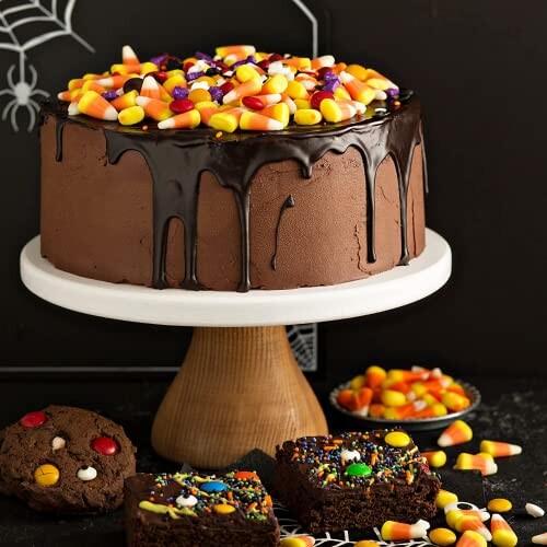 Chocolate cake with candy corn and brownies on a stand