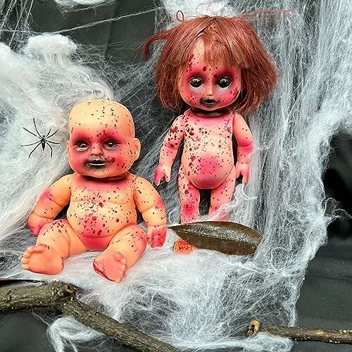 Two creepy dolls with red spots in a spooky setting with spider webs.