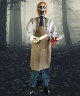 Zombie-like figure holding a chainsaw in a dark forest.