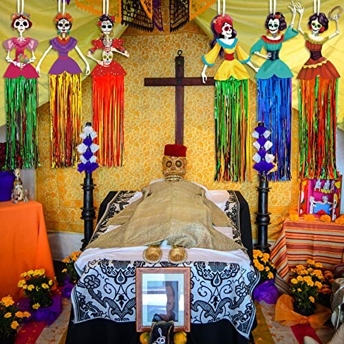 Day of the Dead altar with skeleton figure, colorful decorations, and marigolds.