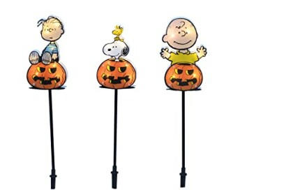 Cartoon characters on pumpkin yard stakes for Halloween