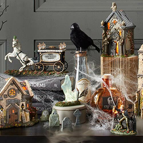 Halloween-themed decorations with a ghost, crow, and haunted houses.