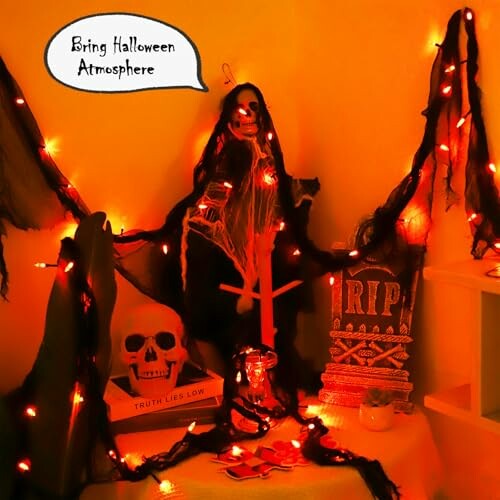 Halloween decor with skeleton, lights, and RIP sign.