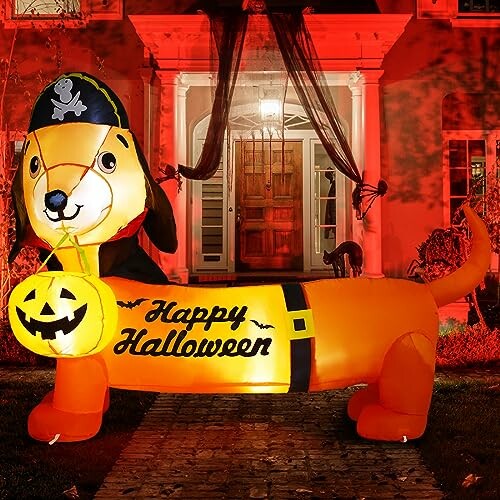 Inflatable dog in pirate costume with Happy Halloween sign and pumpkin lantern.