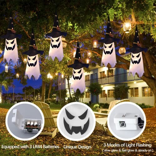 Hanging ghost string lights with witch hats in a decorated outdoor setting.