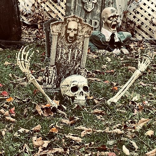 Halloween decorations with skeleton and tombstones in a yard.