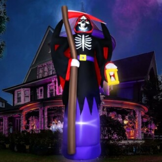 Inflatable Grim Reaper decoration in front of a house.