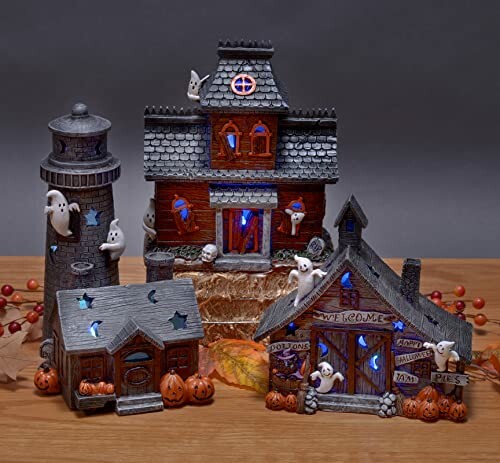 Halloween-themed haunted house decorations with lights and pumpkins