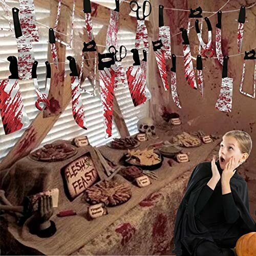 Halloween horror-themed room with bloody decorations and surprised person