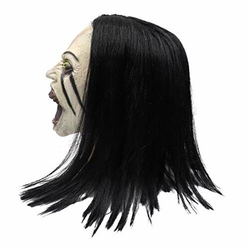 Side view of a scary Halloween mask with black hair and open mouth.