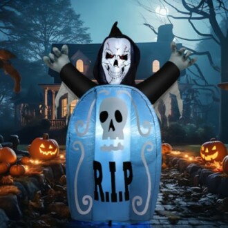 Inflatable Grim Reaper decoration on Halloween night.