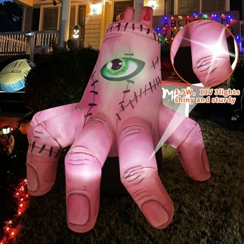 Inflatable Halloween hand decoration with lights on lawn