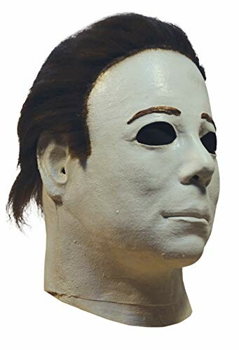 Side view of the white Halloween mask with dark hair