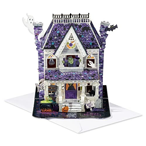 Halloween pop-up card featuring a haunted house with ghosts, bats, and purple roof shingles.