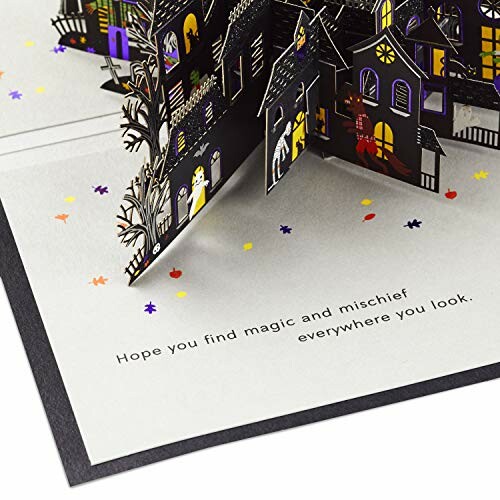 Halloween themed pop-up card with intricate designs and text: 'Hope you find magic and mischief everywhere you look.'