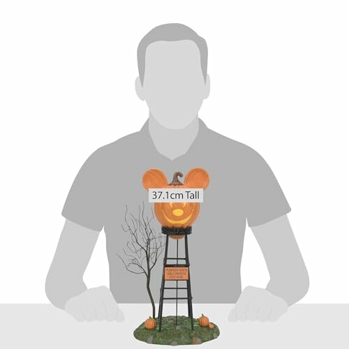 Halloween pumpkin tower decoration with lights and tree