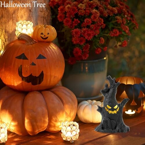 Halloween pumpkins and tree decoration with candles