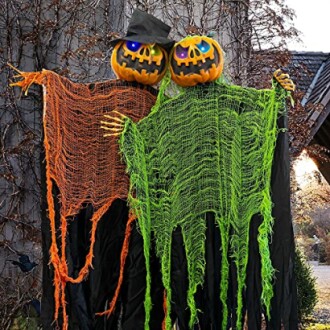 Two pumpkin-headed figures with tattered cloth in Halloween setting.