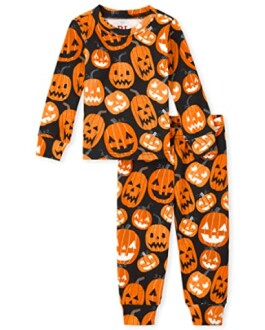 Halloween-themed pajamas with orange pumpkin faces