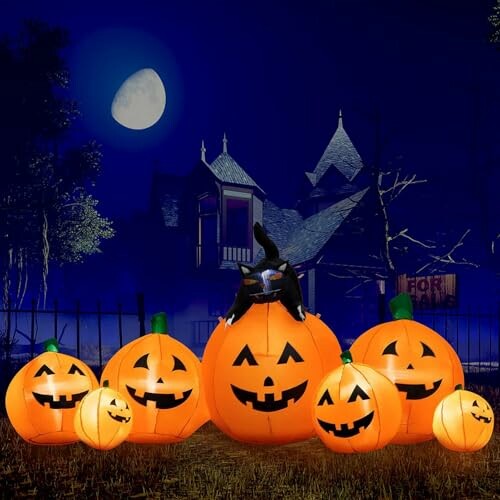 Glowing Halloween pumpkins with witch hat in front of a haunted house and full moon.