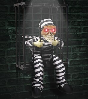 Skeleton prisoner in striped outfit with glowing red eyes in a cage