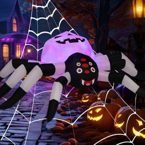 Inflatable spider decoration with pumpkins and Halloween lights.