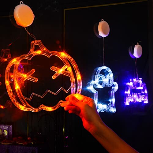 Halloween LED lights with pumpkin, ghost, and castle shapes.