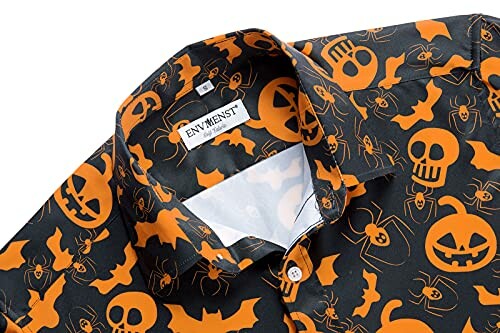 Halloween-themed shirt with pumpkins, bats, and skulls.