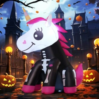 Inflatable Halloween unicorn with skeleton design surrounded by pumpkins and spooky decorations.