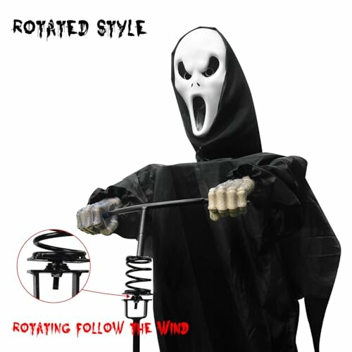 Halloween ghost figure wind spinner with cloak and skull face.