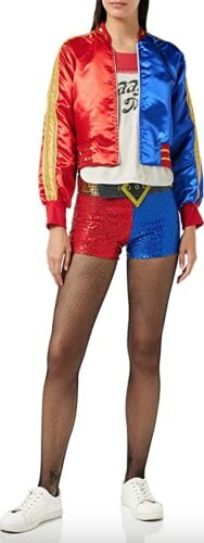 Person in a Harley Quinn costume with a red and blue jacket, sequin shorts, and fishnet tights.