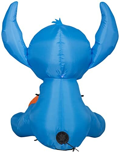 Back view of a large blue inflatable character with big ears