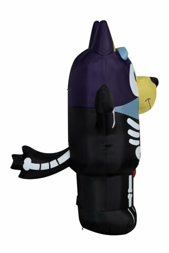 Side view of an inflatable cartoon dog with skeleton design.