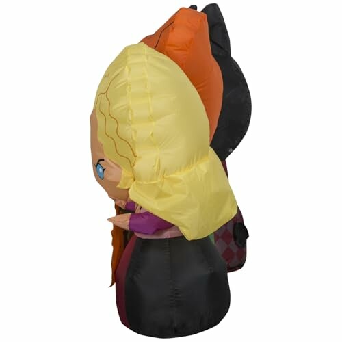 Inflatable Halloween characters with blonde hair and witch hat.