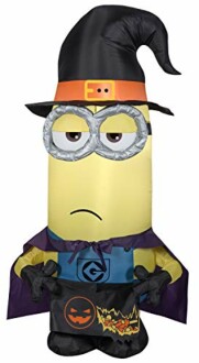 Inflatable Minion in a witch costume with a cape and hat