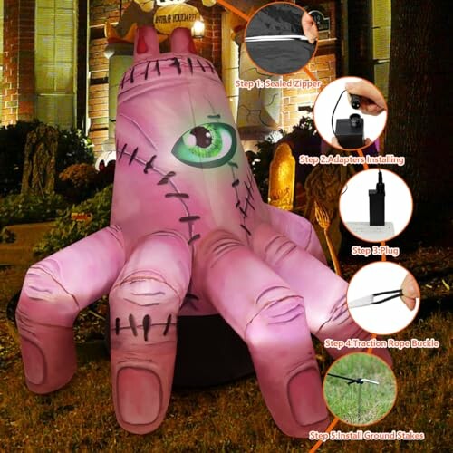 Inflatable pink monster hand decoration with setup instructions.