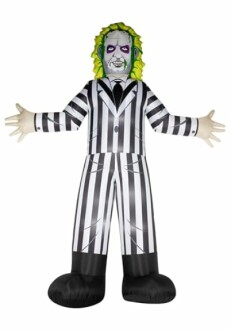 Inflatable figure in black and white striped suit with green hair.