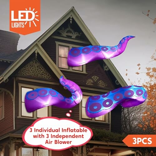 Inflatable tentacle decorations on house with LED lights