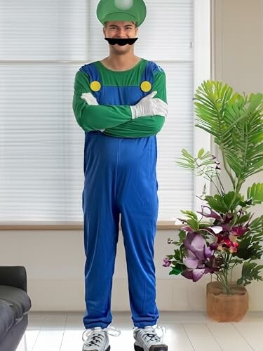 Man in blue and green plumber costume with fake mustache