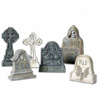 Miniature tombstones with various designs including crosses and skulls.