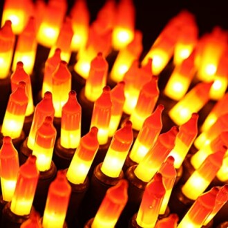 Close-up of glowing orange Christmas lights