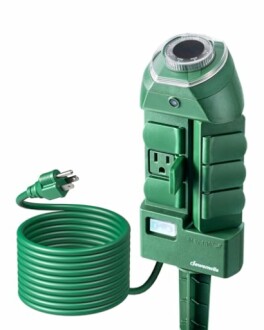 Green outdoor timer power strip with multiple outlets and a coiled cord.