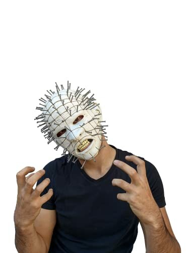 Person wearing a mask with nails protruding