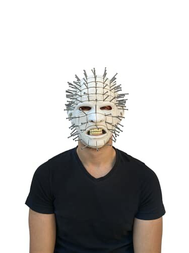 Person wearing a white pinhead mask with a black shirt.