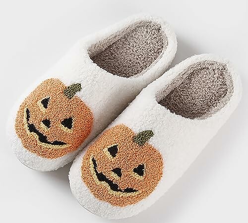 Cozy white slippers with pumpkin design