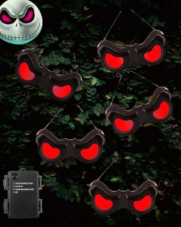 Red glowing eyes mask on leafy background