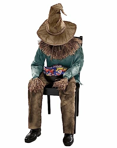 Scarecrow costume on chair holding candy.